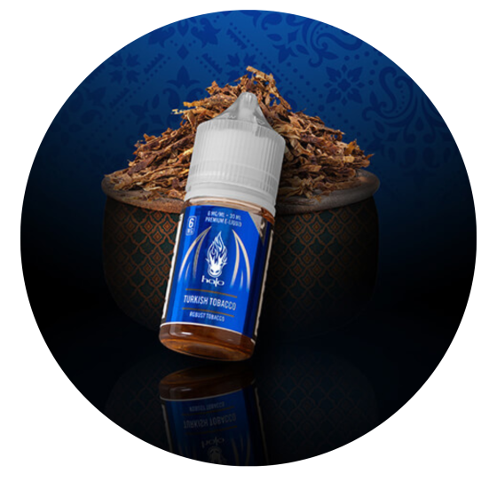 Turkish Tobacco bottle over cured tobacco leaves
